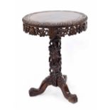 Chinese hardwood circular occasional table, the top carved with a continuous band of fruiting