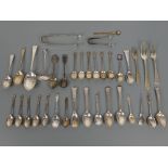 Mixed lot of antique and vintage silver items including spoons, tongs, sifter spoon, bookmark etc,