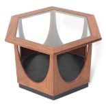 G Plan teak hexagonal glazed top coffee table, upon an ebonised base, 24.5" wide, 17" high
