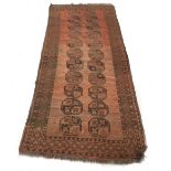 Persian red ground runner, decorated with twin crest/medallion run, within repeated geometric