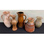 Five pieces of Studio pottery to include three jugs, tallest 10.75" high (at fault); together with a