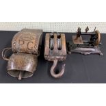 Victorian table-top manual wind sewing machine, 11" wide; together with a ship's winch pulley, 16"