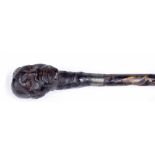 Carved walking staff, the head carved with a native African gentleman bust, 55" long
