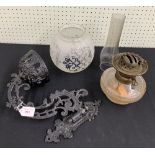 Victorian painted brass wall bracket and glass oil lamp, the scrolling cast hinged bracket and