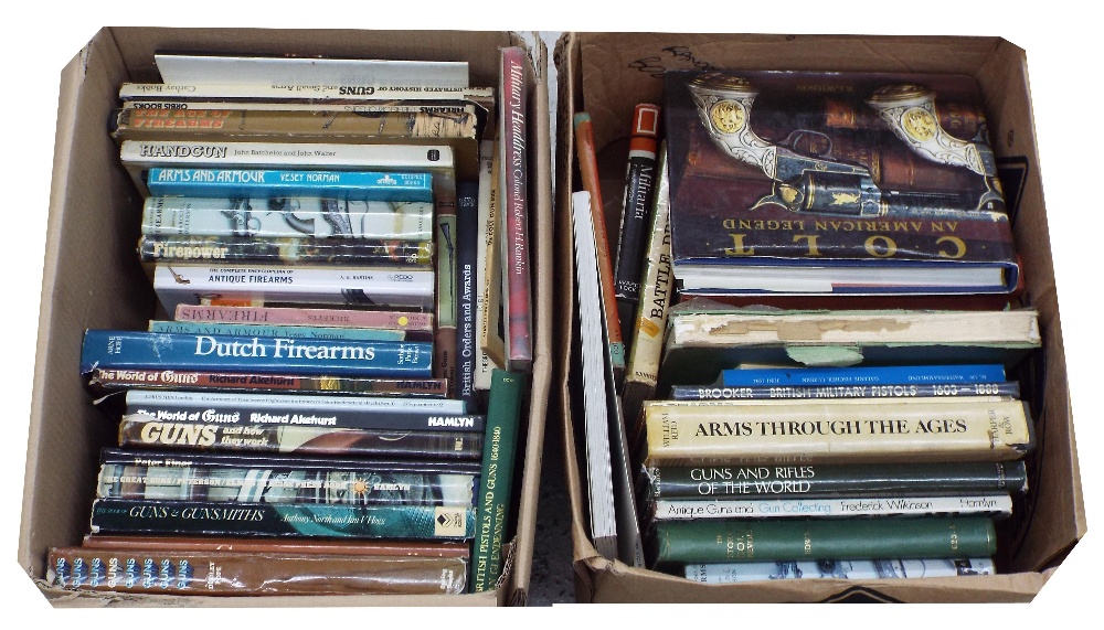 Two boxes of reference books relating to guns and firearms