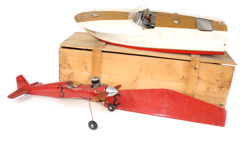Fibreglass scale model pond motor boat, 31" long, (af) stand and crate; together with a partially