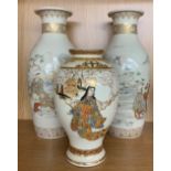 Pair of Japanese Satsuma vases decorated with figures in landscapes, impressed seal mark, 13.5" high