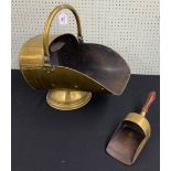 Victorian brass coal scuttle and shovel, with swing handle and upon a circular stepped base, 20"