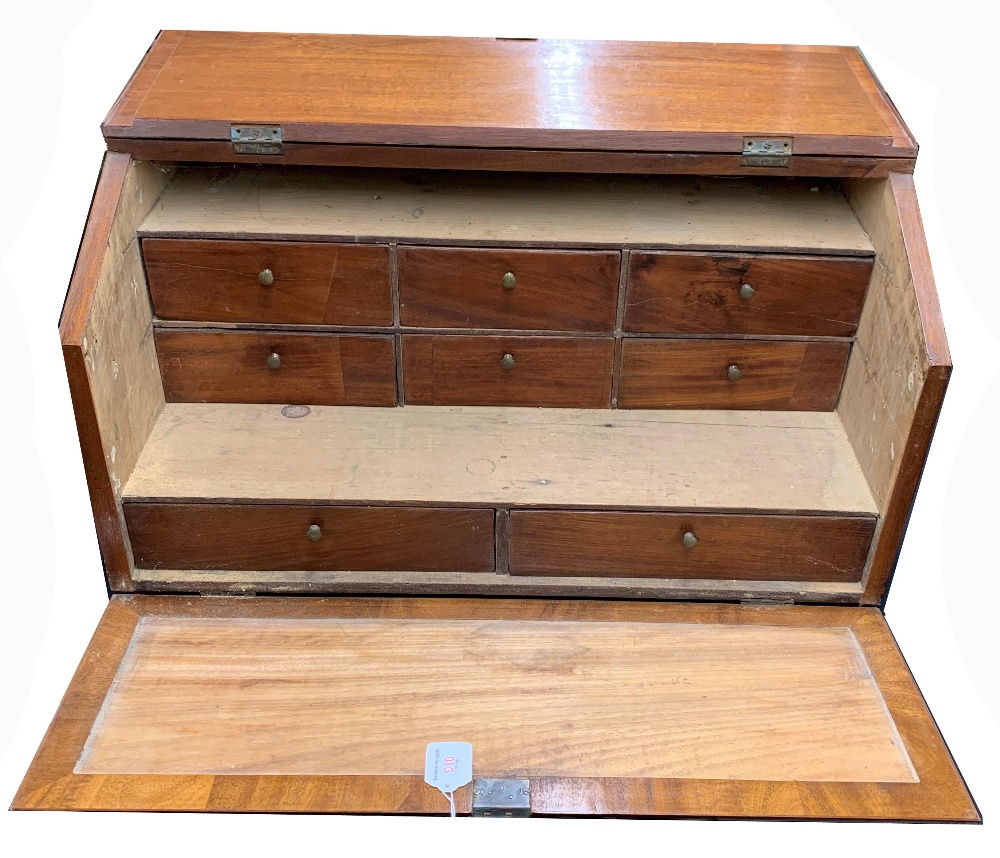 Mahogany table top stationary cabinet, the hinged fall front and raising top enclosing fitted