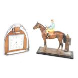Smiths eight day stirrup clock, 5.5" high; together with a cold painted cast metal table match