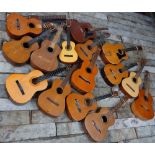 Fourteen various acoustic guitars in need of rebuilding and/or restoration including an Eko Ranger