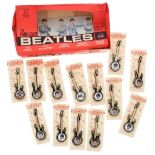 The Beatles - thirteen Invicta Beatles guitar brooches, ex shop stock within an original display box