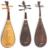 Three Chinese pipa lutes all in need of attention