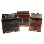 Three melodeons in various conditions, including a Saxa-Gold-Melodeon, a Meinel & Herold and one