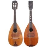 Two similar bowl back mandolins, one with friction tuning head, the other with open peg box (2)