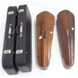 Two black oblong double violin cases; also two old single coffin violin cases with brass handles (