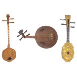 Decorative Thai Sueng lute; together with a Chinese yueqin moon lute and another Chinese lute (3)