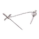 Arnold Dolmetsch's tie pin, in the form of a stiletto and sheath, in silver coloured metal, in