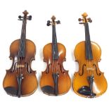 Two mid 20th century three-quarter size violins and a half size violin (3)
