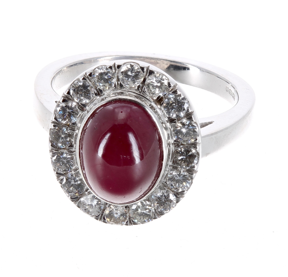 Good 18ct white gold diamond and ruby cabouchon oval cluster ring, the ruby 3.90ct approx, in a