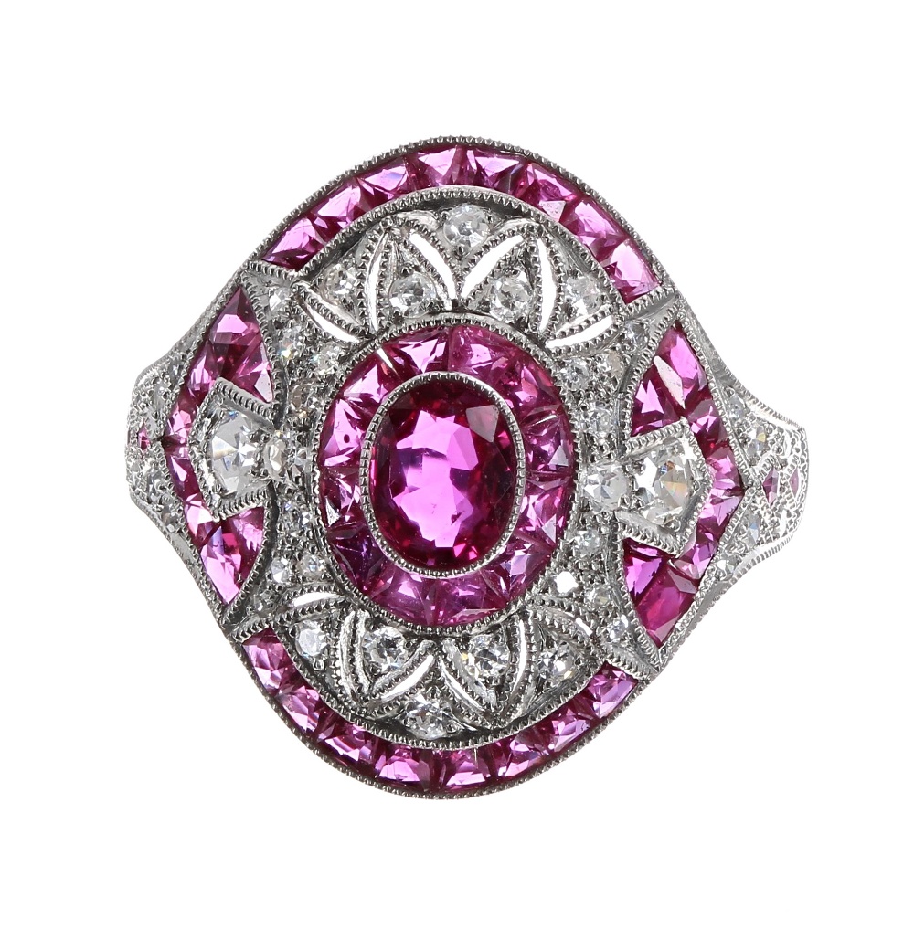 Ornate platinum ruby and diamond oval cocktail ring, set with oval ruby surrounded by a halo of - Image 2 of 2