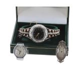 White metal lady's 'case winding' bangle watch, black enamel dial with Arabic numerals, minute track