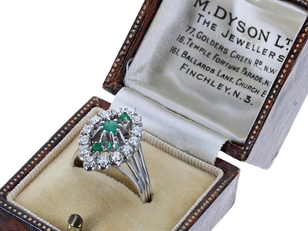 18ct white gold emerald and diamond marquise cluster ring, with three central round emeralds in a