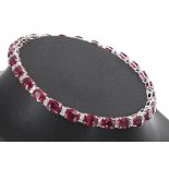 18ct white gold ruby and diamond line bracelet, with twenty-six treated rubies, estimated 1.14ct