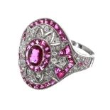 Ornate platinum ruby and diamond oval cocktail ring, set with oval ruby surrounded by a halo of