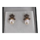 Attractive pair of cultured pearl earrings, with diamond bow tops, 4.2gm, 21mm; with boxed