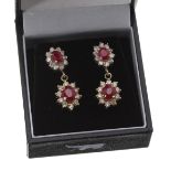 Fine pair of 18ct ruby and diamond drop earrings, each with two graduated oval clusters with a