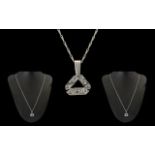 18ct White Gold - Attractive Diamond Set Pendant with Attached 9ct White Gold Chain.