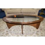 G Plan Teak Oval Shaped Coffee Table with glass top supported on a shaped base.