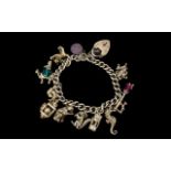A Vintage Nice Quality Sterling Silver Curb Bracelet loaded with over 12 charms.