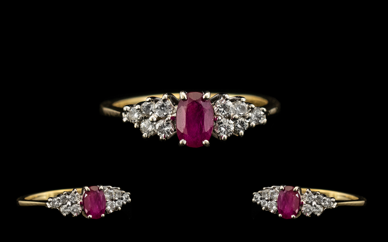 18ct Gold - Attractive Ruby and Diamond Dress Ring. The Central Ruby of Excellent Rich Red Colour.