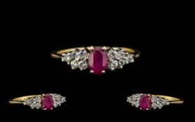 18ct Gold - Attractive Ruby and Diamond Dress Ring. The Central Ruby of Excellent Rich Red Colour.