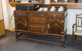 1930's Carved Oak Side Board with a small carved wood back with grape carving.