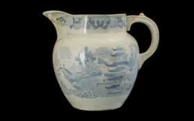 19thC Large Blue and White Printed Staffordshire Milk Jug in the willow pattern. 9.