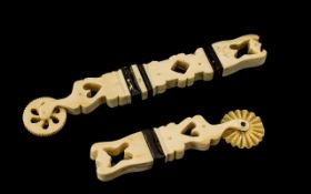 Scrimshaw Bone Saliors Crimping Wheels, carved Decoration to the body with heart apertures..