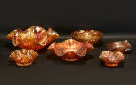 Marigold Carnival Glass six various moulded glass bowls, miscellaneous sizes. Please see images.