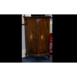 George III Bow Fronted Mahogany Corner Cabinet of typical form with internal fixed shelves,