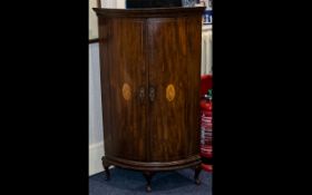 George III Bow Fronted Mahogany Corner Cabinet of typical form with internal fixed shelves,