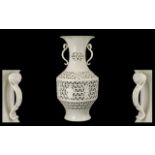 Chinese Blanc-de-Chine Reticulated Vase finely potted and with detailed decorations depicting