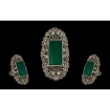 Art Deco Style Marcasite Silvered Metal Ring marked 925. Set with an oblong green coloured stone.