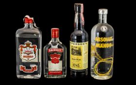 Collection of Spirits comprising Absolut Mango Vodka 1 litre; Smolenskoff Vodka 1 litre; and