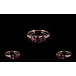 Rose Garnet and Diamond Ring, three oval cut rose garnets,