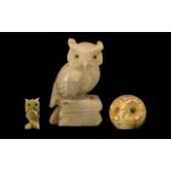Collection of Three Owl Figures comprising an Onyx owl figure raised on a base with glass eyes,