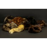 Collection of Vintage Fur Stoles and Scarves to include two long Mink scarves; a golden fur scarf;