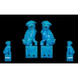 Chinese Turquoise Glazed Pair of Temple Dogs, seated on bases (Republic period) unglazed bases.