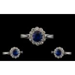 18ct White Gold 1950's Sapphire and Diamond Set Cluster Ring the central faceted sapphire of